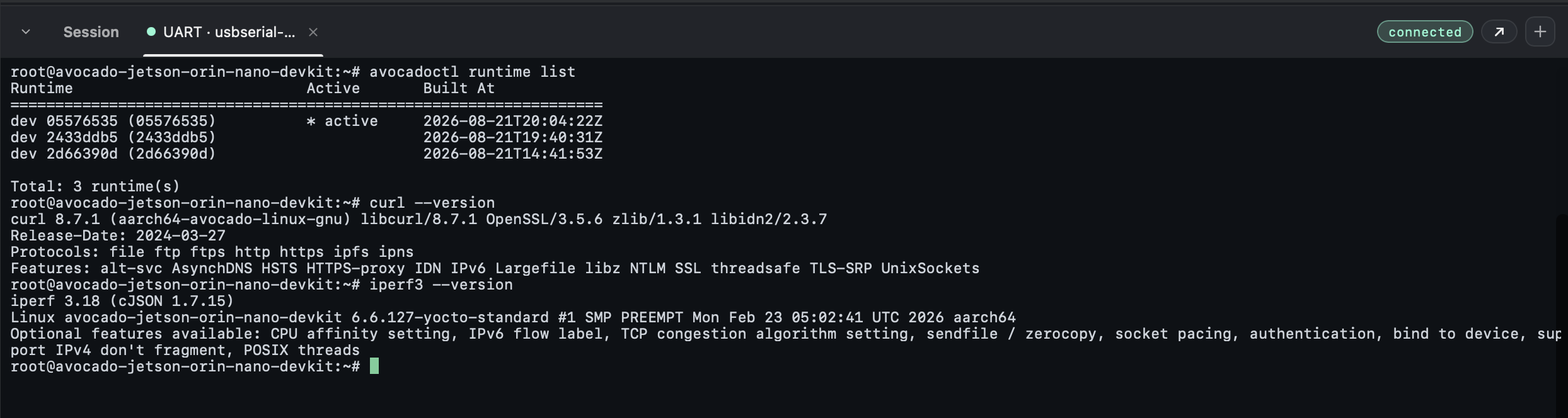 A UART session on the device after the Desktop OTA: avocadoctl runtime list shows three runtimes with the newest active, and curl and iperf3 version checks confirm the deployed packages are present.